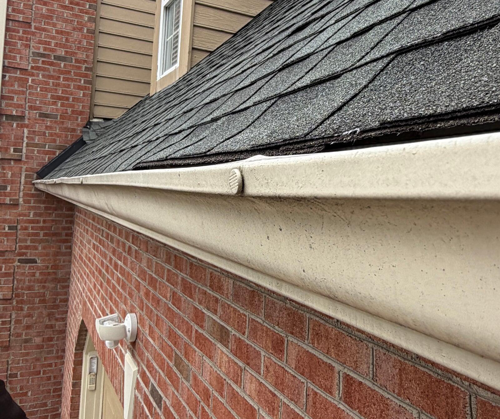 image of a gutter with nail and ferrule hangers